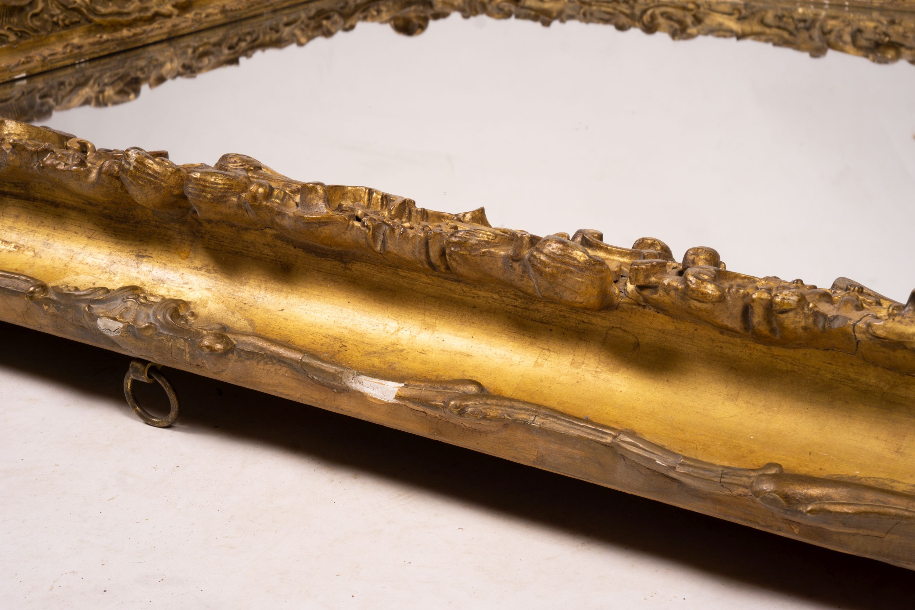 An ornate Victorian giltwood and gesso rectangular wall mirror (formerly a picture frame) width 130cm, height 112cm